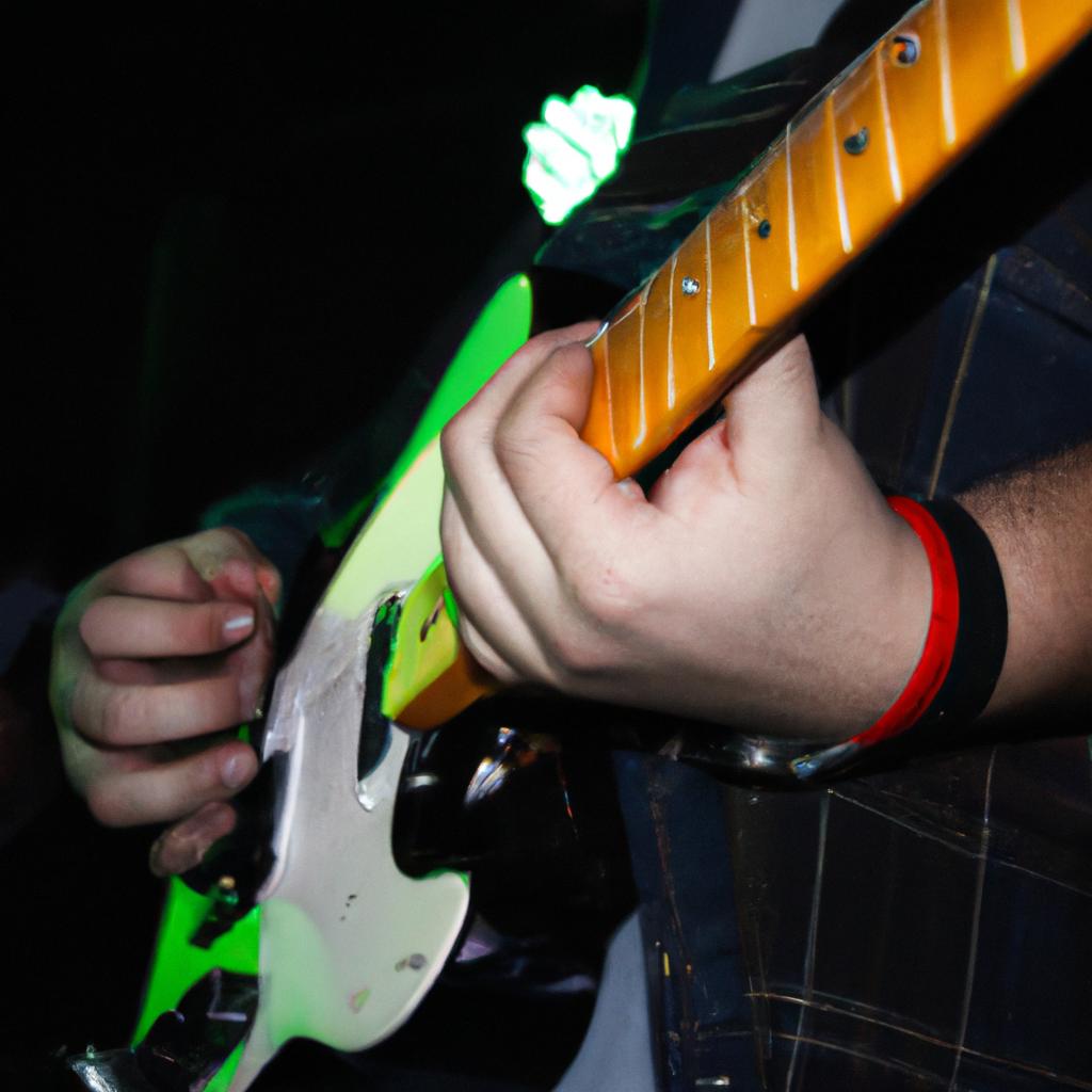 Person playing guitar on stage